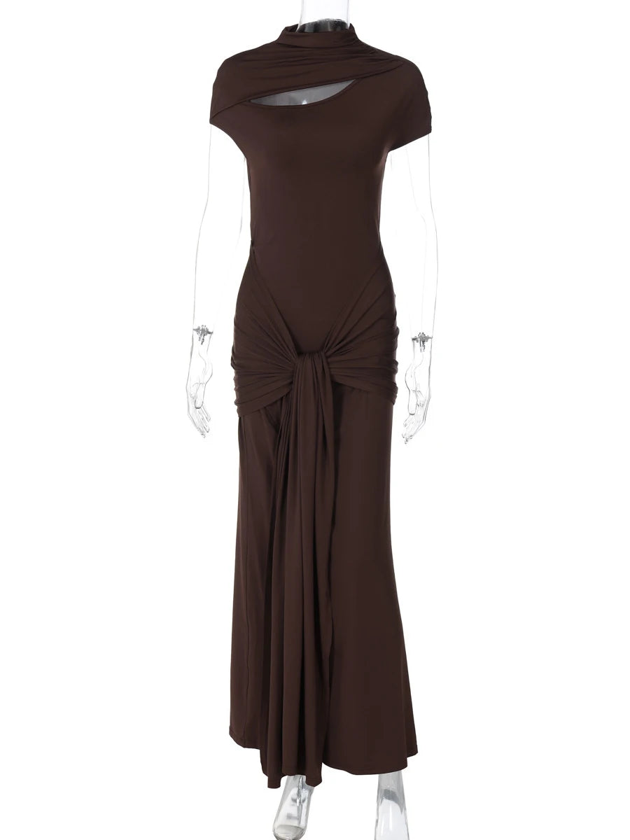Brown dress on a mannequin against a white background