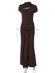 Brown dress on a mannequin against a white background