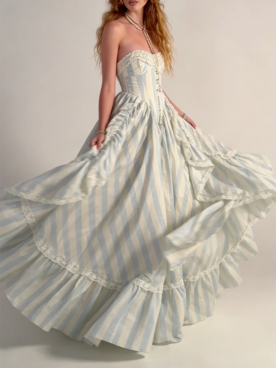 Strapless striped ruffled gown with cascading layers in motion