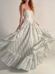 Strapless striped ruffled gown with cascading layers in motion