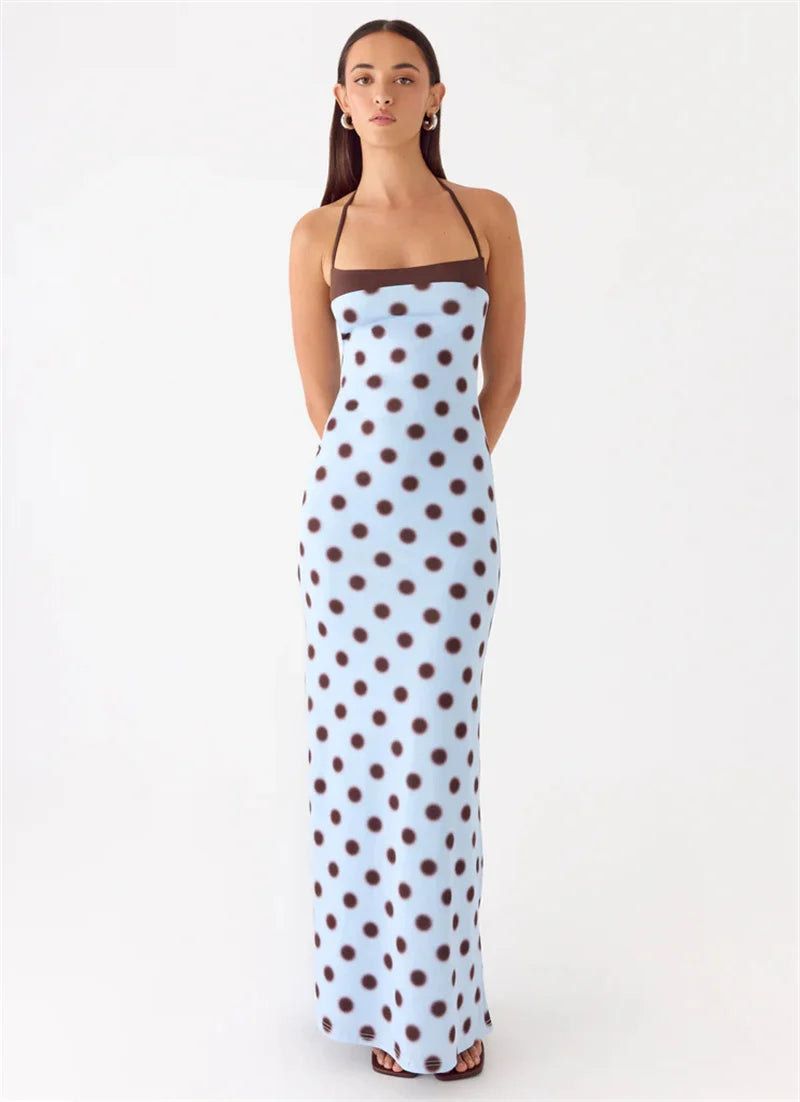 Woman wearing a polka dot dress on a white background