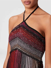 Close-up of a person wearing a sequined dress with a white background