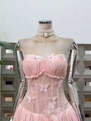 Mannequin wearing a pink lace dress with a pearl necklace against a neutral background