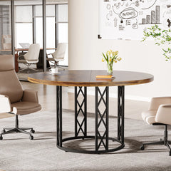 Round wooden table with metal legs in a modern office setting