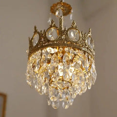 Close-up of a French crystal chandelier showcasing the intricate details of the crown design and sparkling crystals. A