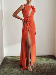 Model wearing an orange asymmetrical neck floral maxi dress