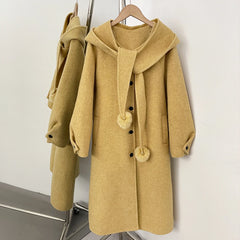 Hooded wool blend coat in yellow with a detachable pom-pom scarf.