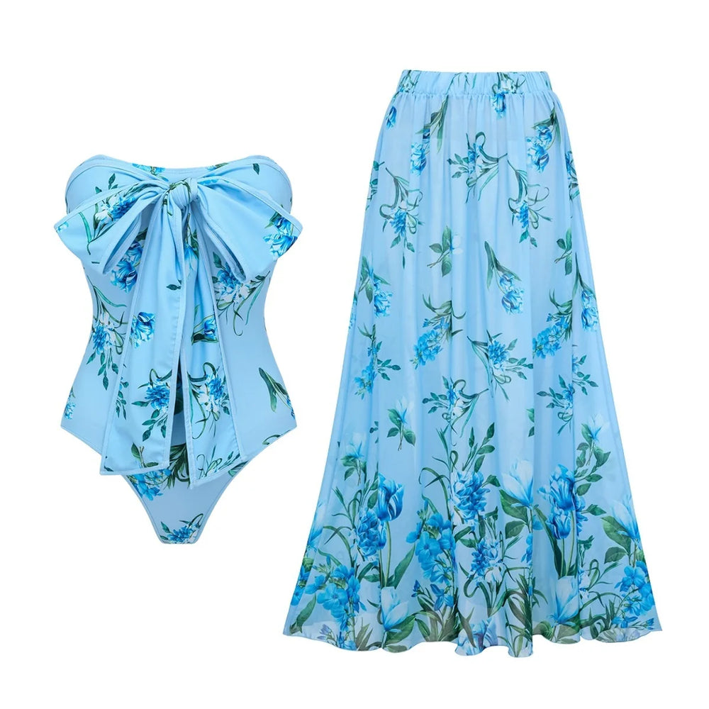 Blue floral print bandeau swimsuit and matching maxi skirt cover-up.