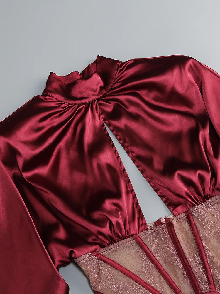 Red satin garment with sheer lining on a light gray background