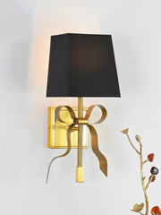 Modern retro bow-shaped LED wall lamp in black and gold finish with a fabric shade. Golden Atelier 3