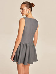 A grey knitted mini Dress with a flared skirt and decorative buttons.