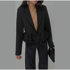 Fitted crop blazer featuring a cinched waist and soft ruffles
