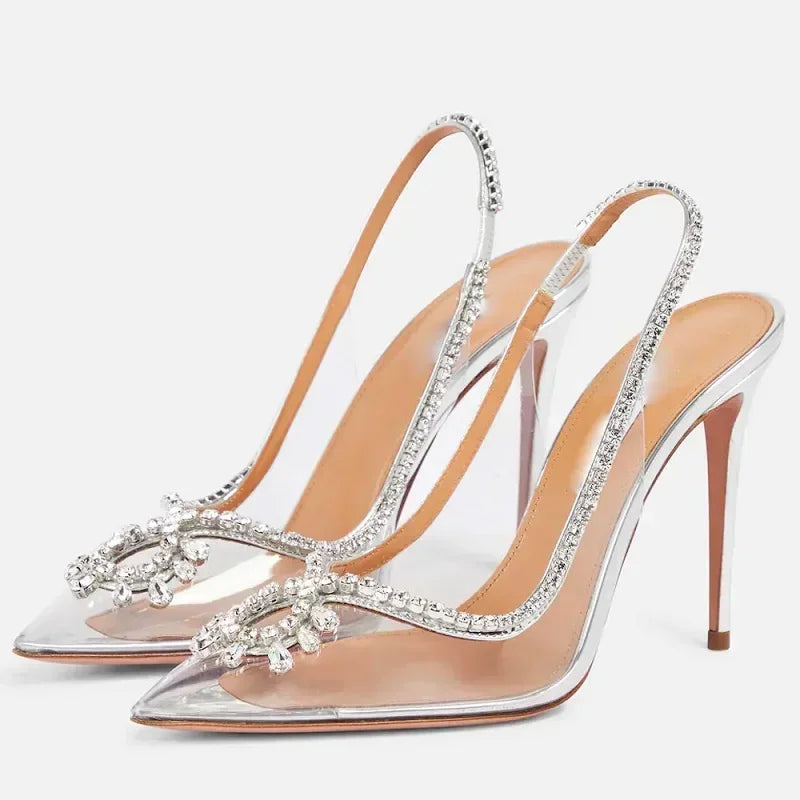 Crystal transparent pumps featuring thin heels for a sleek look.