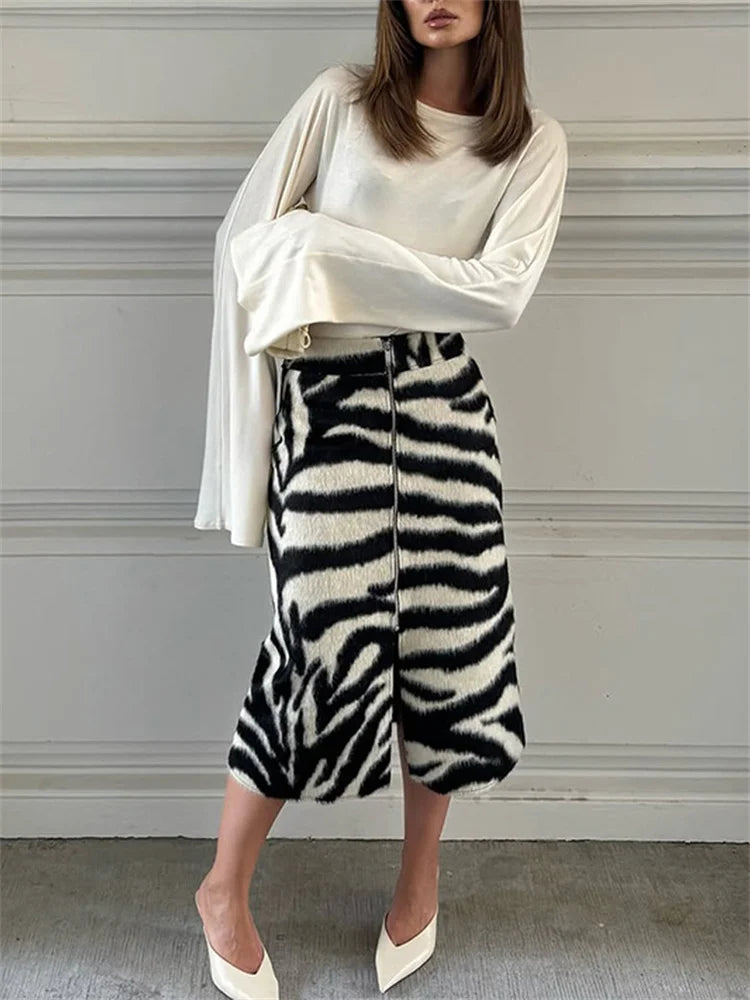 Model wearing zebra print midi skirt with white top