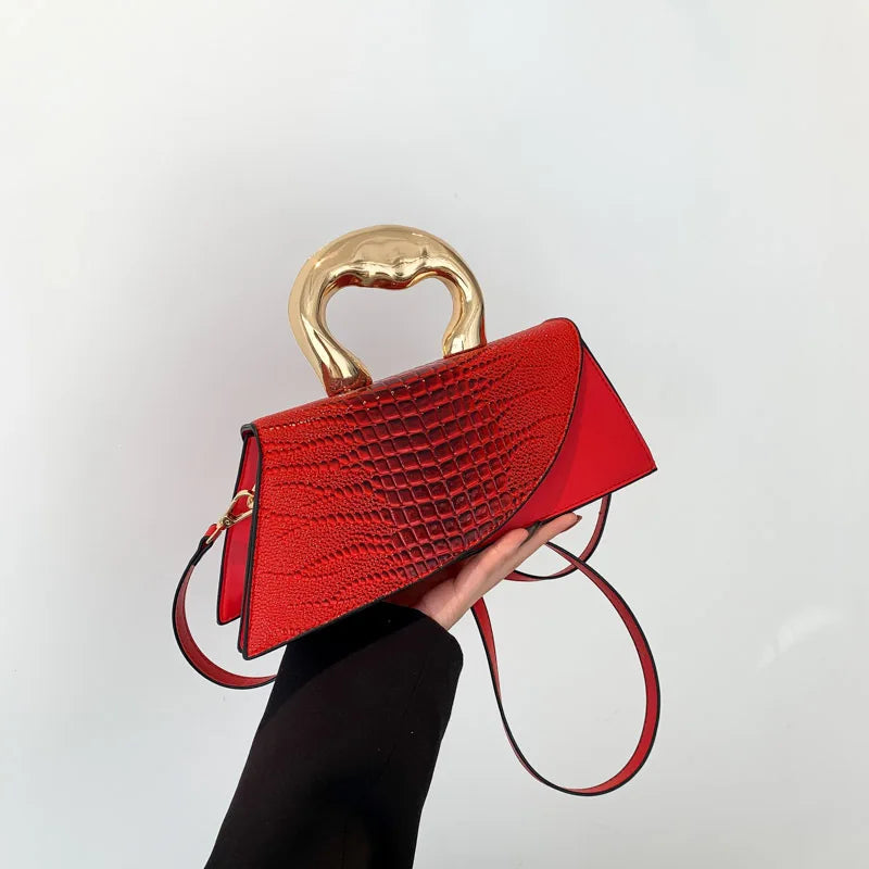 Red alligator textured top handle bag with golden handle