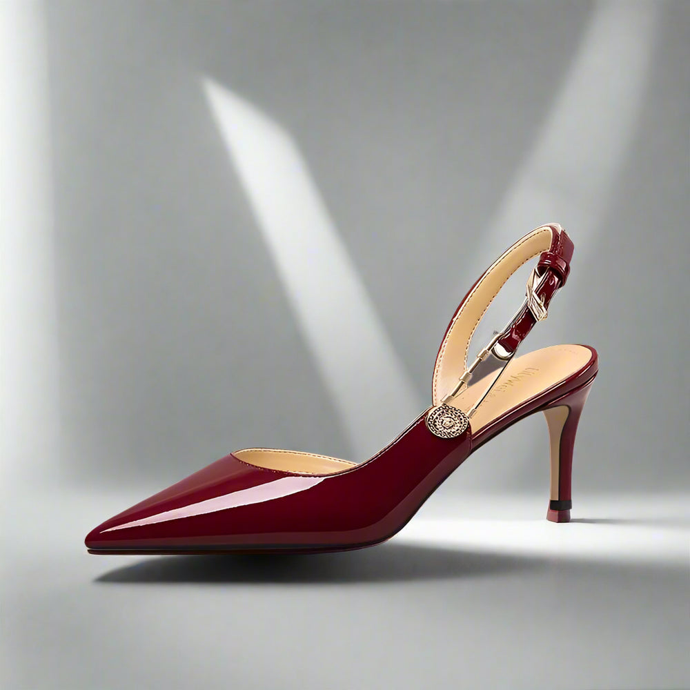 Red high-heeled shoe on a light gray background