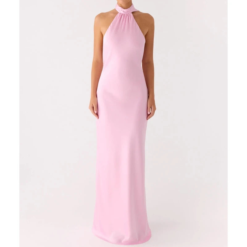 Pink halter neck gown on a white background