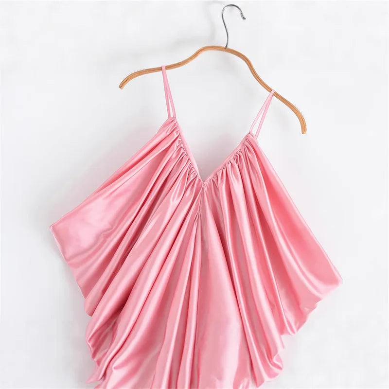 Pink satin dress on a wooden hanger 