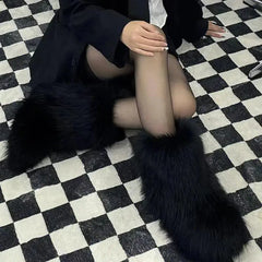 Woman wearing Fluffy Faux Fox Fur Winter Boots from Golden Atelier, showcasing the full boot and fur details.