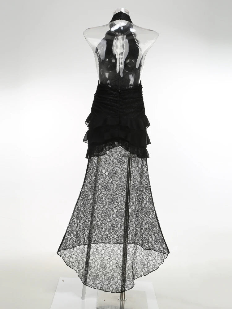 Black lace dress on a mannequin against a white background