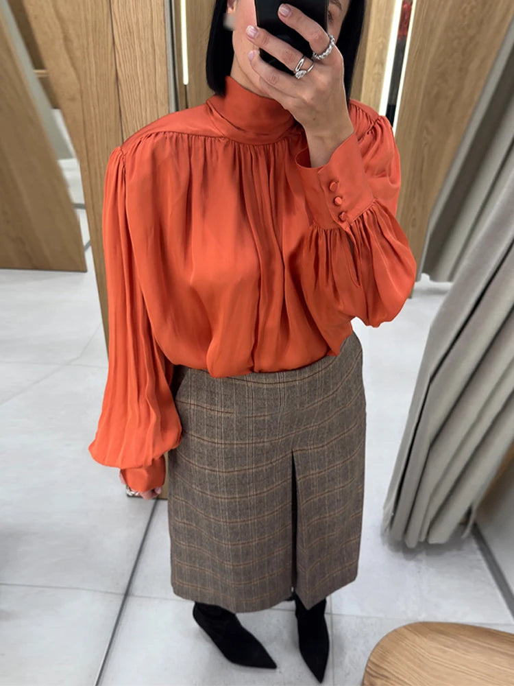 Standneck long sleeve blouse with fold ribbon and button cuffs