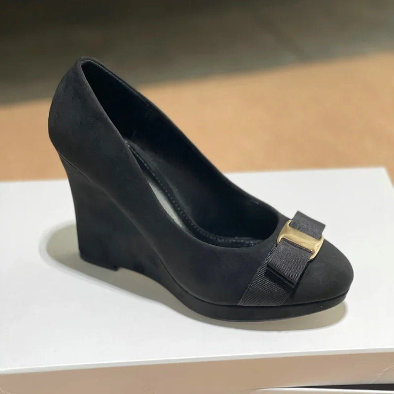 Black suede bow platform wedge pump
