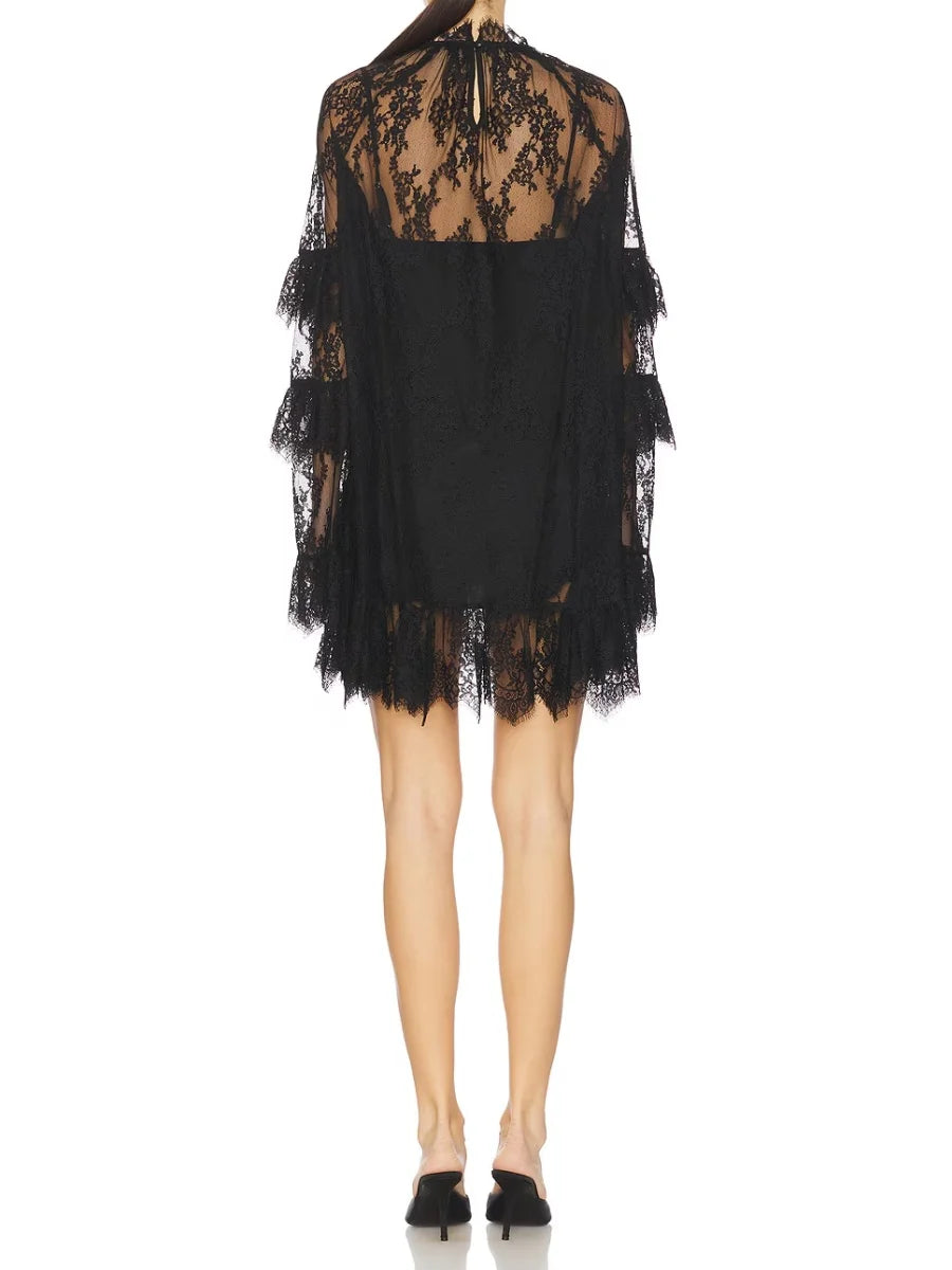 Black lace dress with sheer overlay - back