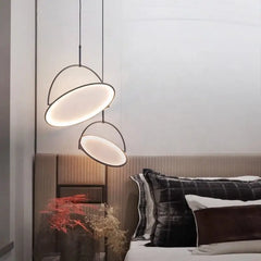 A sleek, modern LED pendant light hanging above a minimalist  bed room . 1