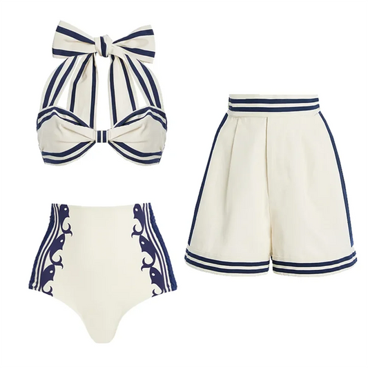 Striped halter bow bikini top and high-waisted shorts set laid flat