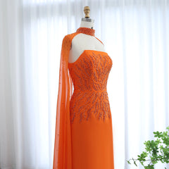 Mannequin displaying wearing the orange cape sleeve gown, showcasing its flattering silhouette and graceful movement.  Golden Atelier 3