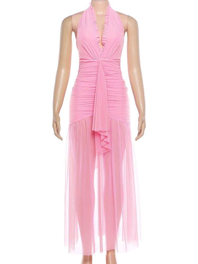 Mannequin wearing a pink halter neck dress on a white background