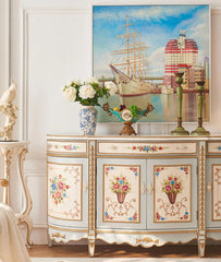 Decorative cabinet with floral designs in a stylish interior setting.