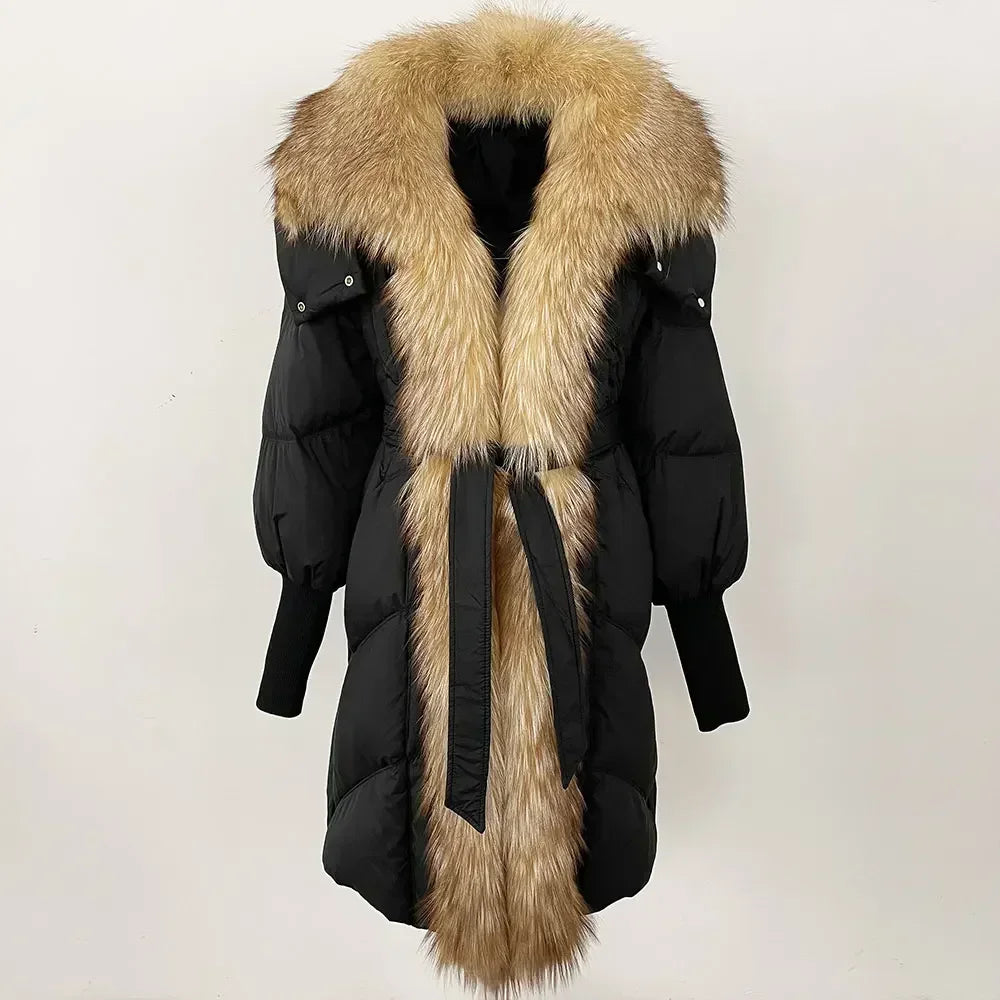 Black winter coat with a large fur collar on a white background