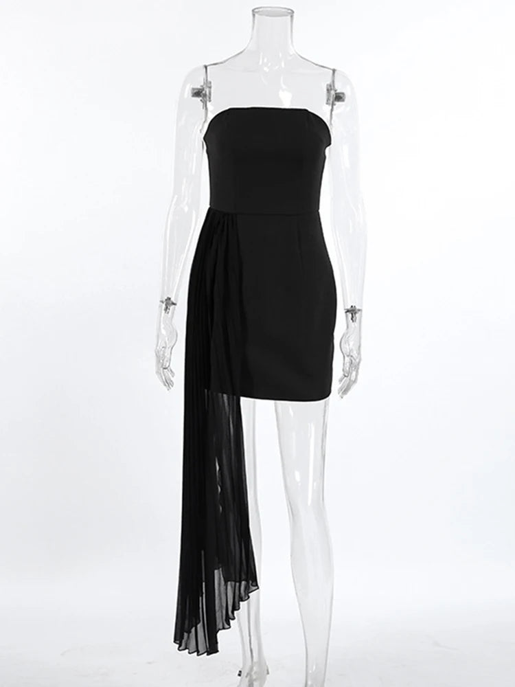 Black strapless dress with sheer overlay on a mannequin against a white background