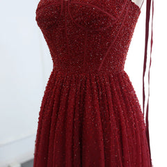 Mannequin displaying the wine-red beaded evening gown, showcasing its flattering silhouette and elegant design. Golden Atelier 4