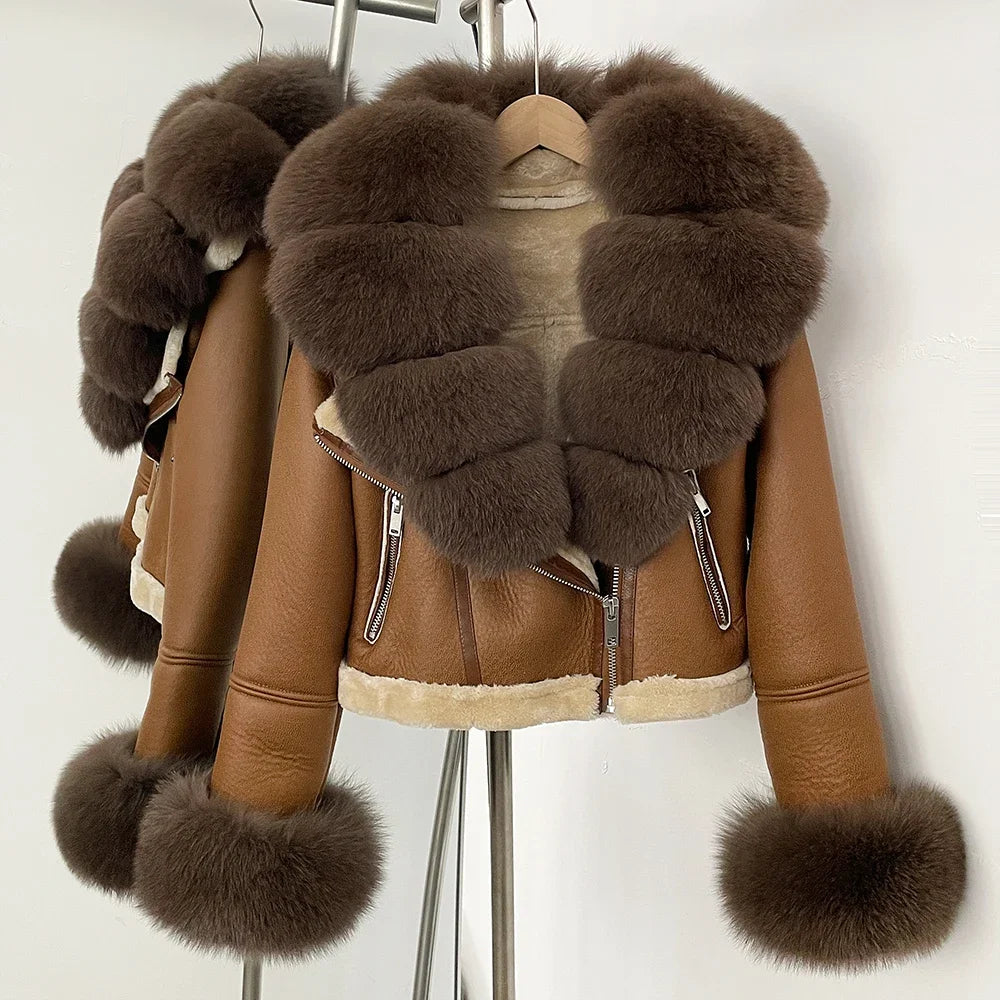 Brown leather jacket with fur trim on a hanger against a white background