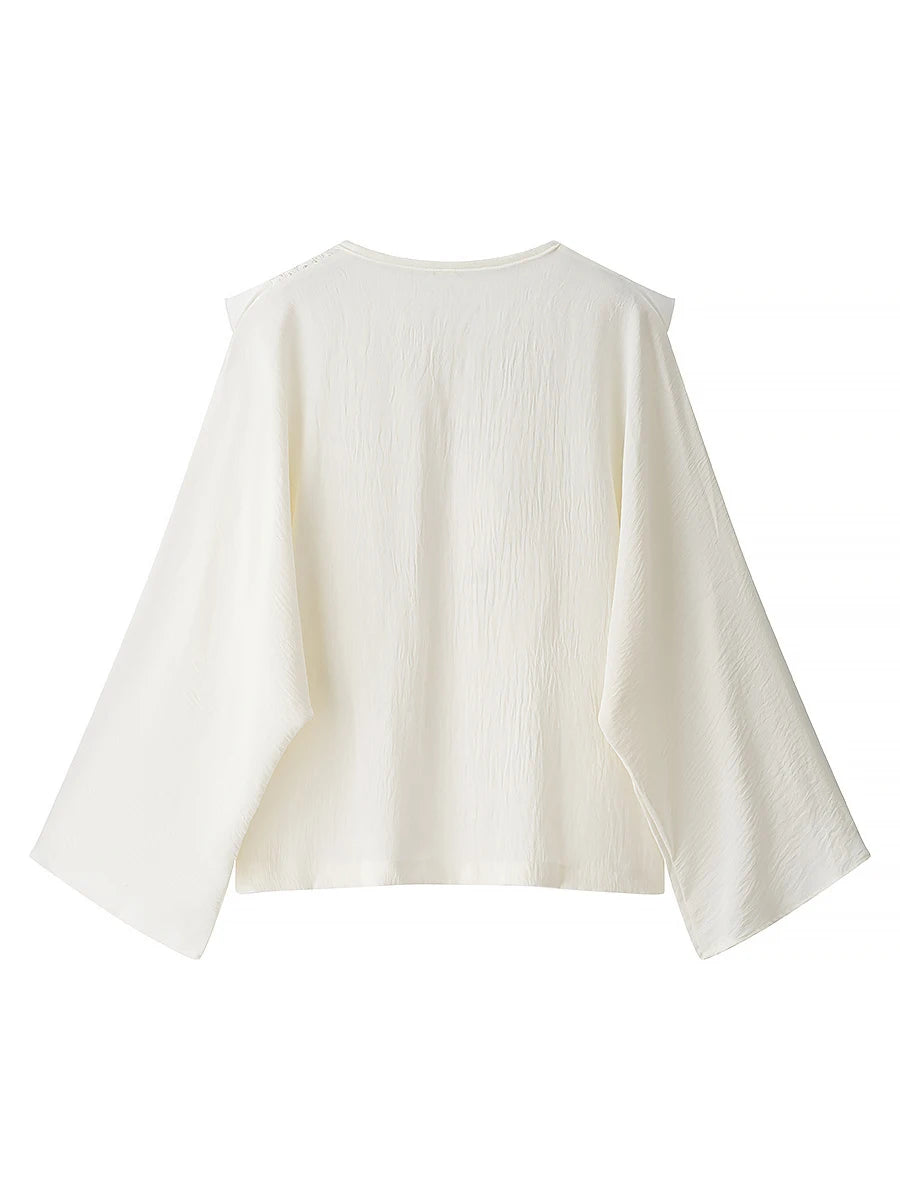 White blouse with bell sleeves on a white background