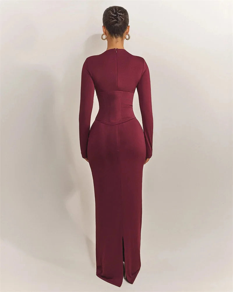 Burgundy evening gown with long sleeves on a white background
