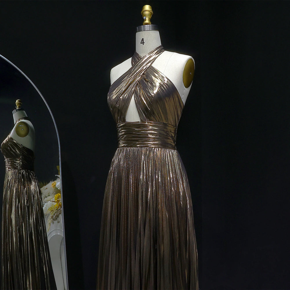 Metallic dress on a mannequin against a black background
