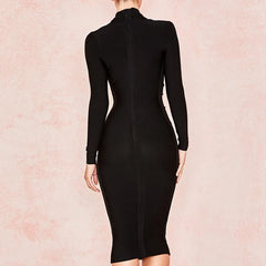 Black dress on a model against a pink background