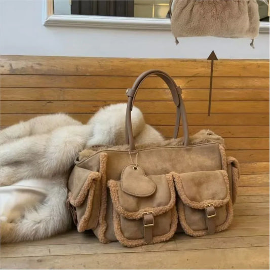 Caramel brown suede tote bag with shearling trim and multiple pockets