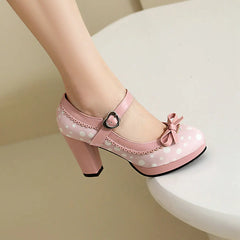 Pink polka dot Mary Jane platform heels with ankle strap and bow