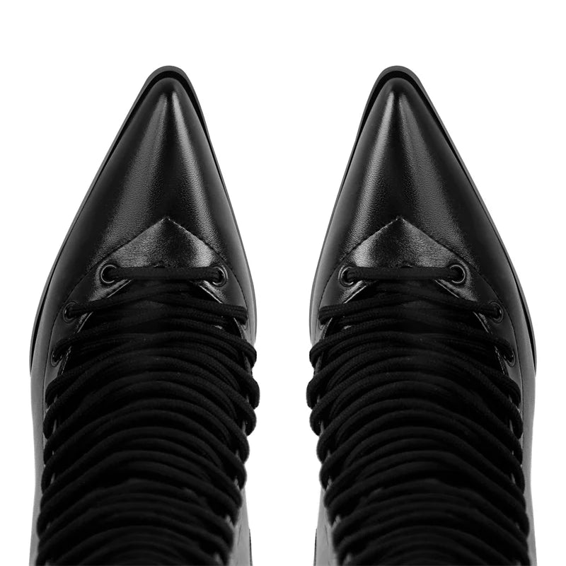 Top view of pointed toe on lace-up knee-high boots