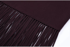 Close-up of fringe hem on burgundy knitted dress