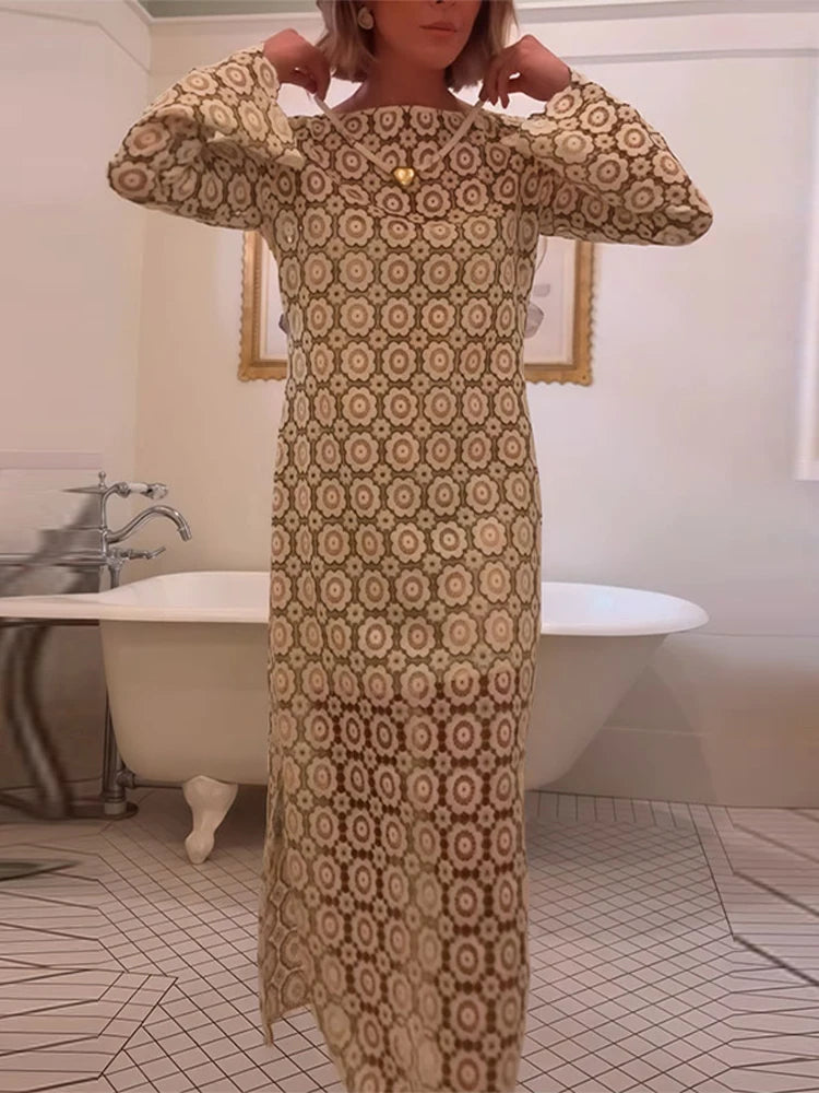Person wearing a patterned dress in a bathroom setting