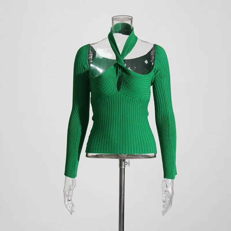 Green ribbed sweater on a mannequin against a gray background
