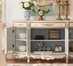 Decorative cabinet with ornate design in a room setting