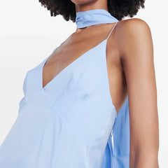 Light blue sleeveless top worn by a person on a white background