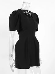 Black dress on a transparent mannequin against a white background