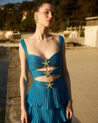 Women’s cover-up skirt with geometric print and strappy shoulder design.